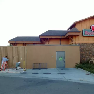 Timmins painting employees painting Applebee's in Sonoma County