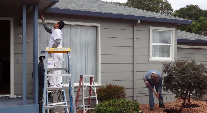 Timmins Painting working on exterior of home