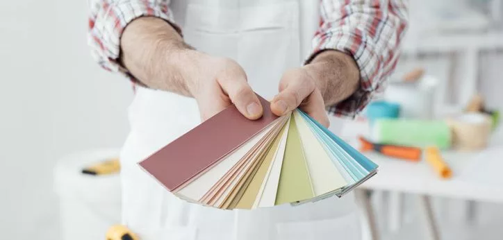 Painter fanning out color samples