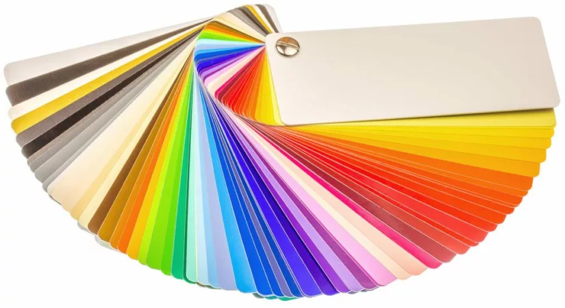 Collection of paint color cards fanned out.