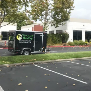 professional painter trailer parked in front of office building read to be painted