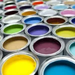 colorful selection of different paint colors in cans