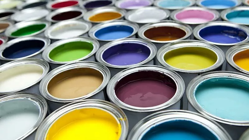 colorful selection of different paint colors in cans