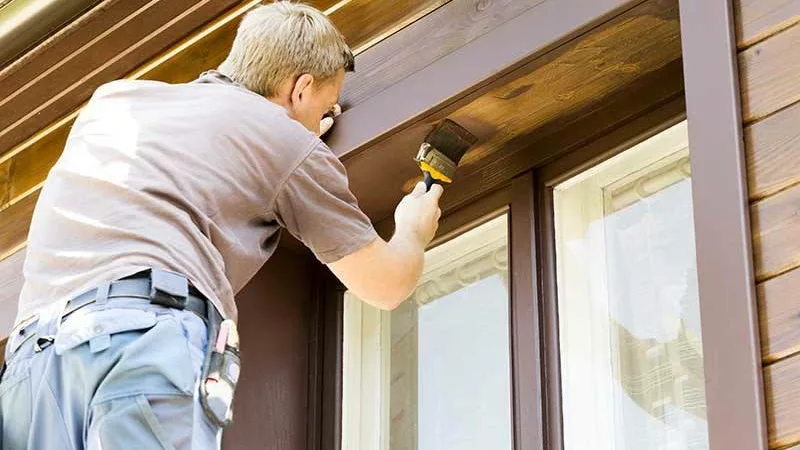 professional painting painting the exterior of a home