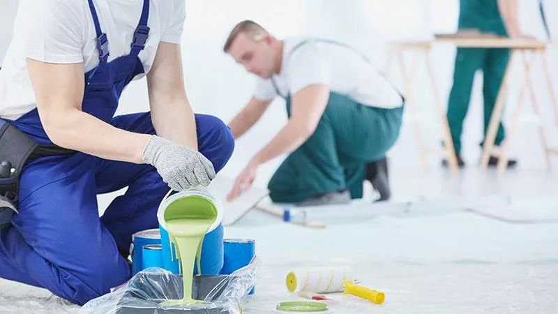 professional painters setting up a worksite to paint