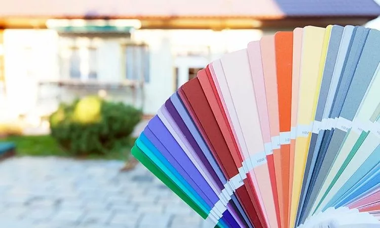 paint color swatches compared to exterior of home