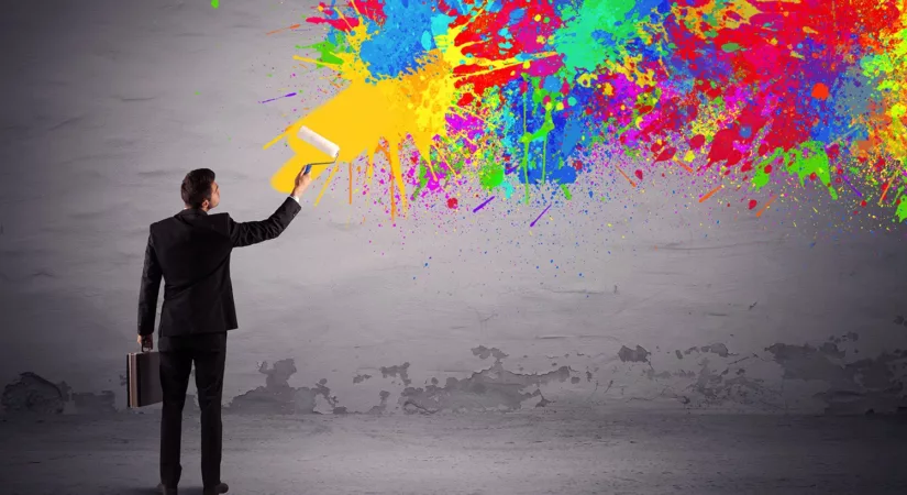 business owner contemplates what color to paint the exterior of his business building