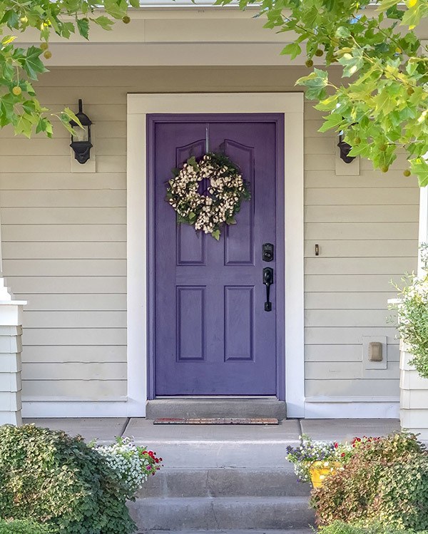 A front door freshly painted Pantone's 2022 color of the year Very peri 