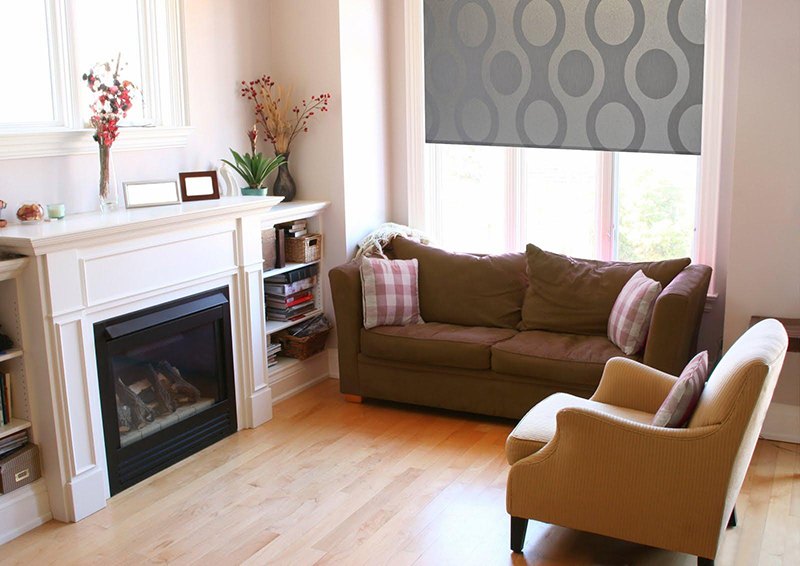 Living room, with fire place and laminate flooring, painted in pale pink