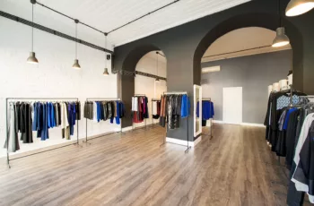 interior of high-end fashion boutique freshly painted to make white, grey, and black business branding