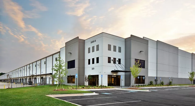 The exterior of a commercial property with green grass and well-maintained paint