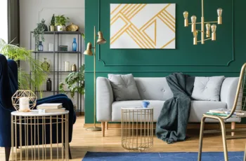 A modern living room with a dark green accent wall, showing the concept of how to choose living room accent wall colors
