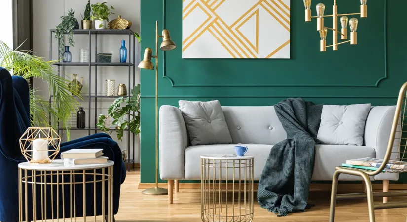 A modern living room with a dark green accent wall, showing the concept of how to choose living room accent wall colors